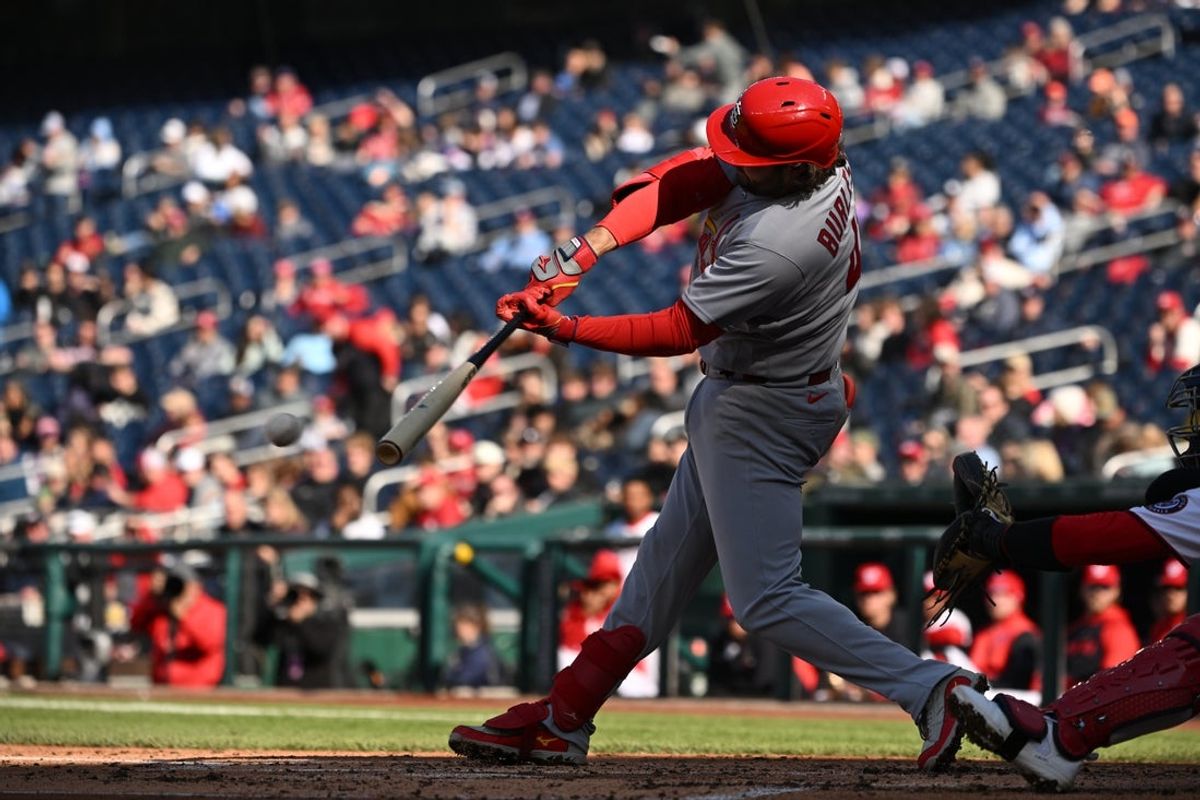 Apr 8, 2026; Washington, District of Columbia, USA; St. Louis Cardinals first baseman Alec Burleson (41) hits a 2 RBI single against the Washington Nationals during the second inning at Nationals Park. Mandatory Credit: Rafael Suanes-Imagn Images