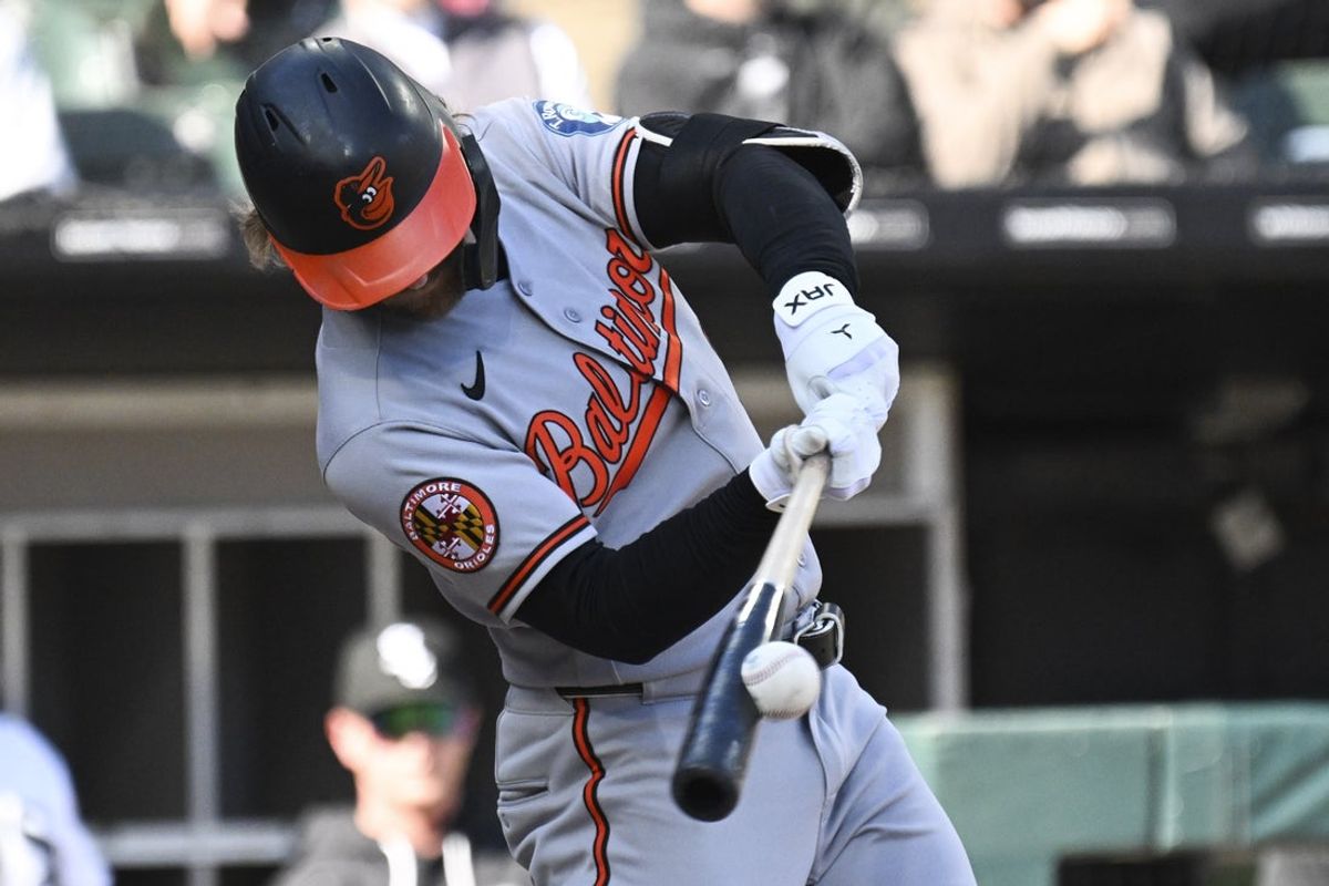 Apr 8, 2026; Chicago, Illinois, USA;  Baltimore Orioles left fielder Taylor Ward (3) hits an RBI double during the ninth inning against the Chicago White Sox at Rate Field. Mandatory Credit: Matt Marton-Imagn Images
