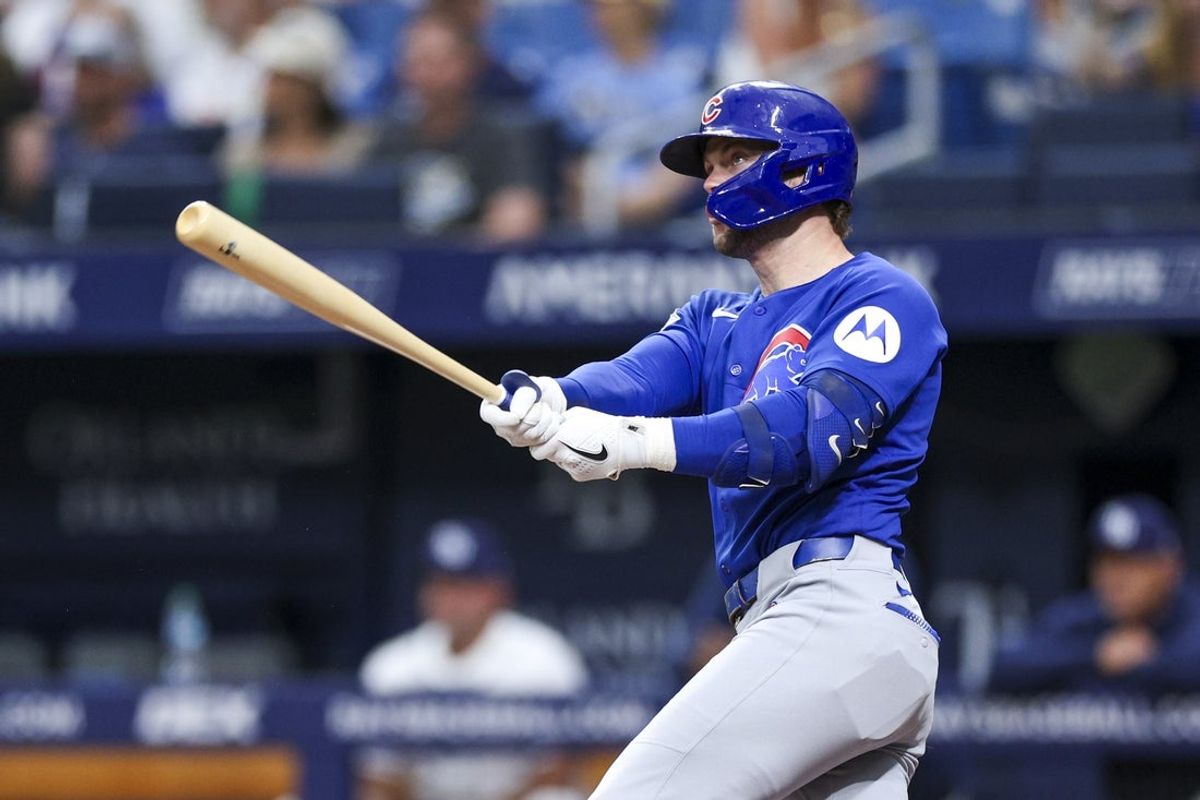 Apr 8, 2026; St. Petersburg, Florida, USA; Chicago Cubs second baseman Nico Hoerner (2) hits a solo home run against the Tampa Bay Rays in the first inning  at Tropicana Field. Mandatory Credit: Nathan Ray Seebeck-Imagn Images