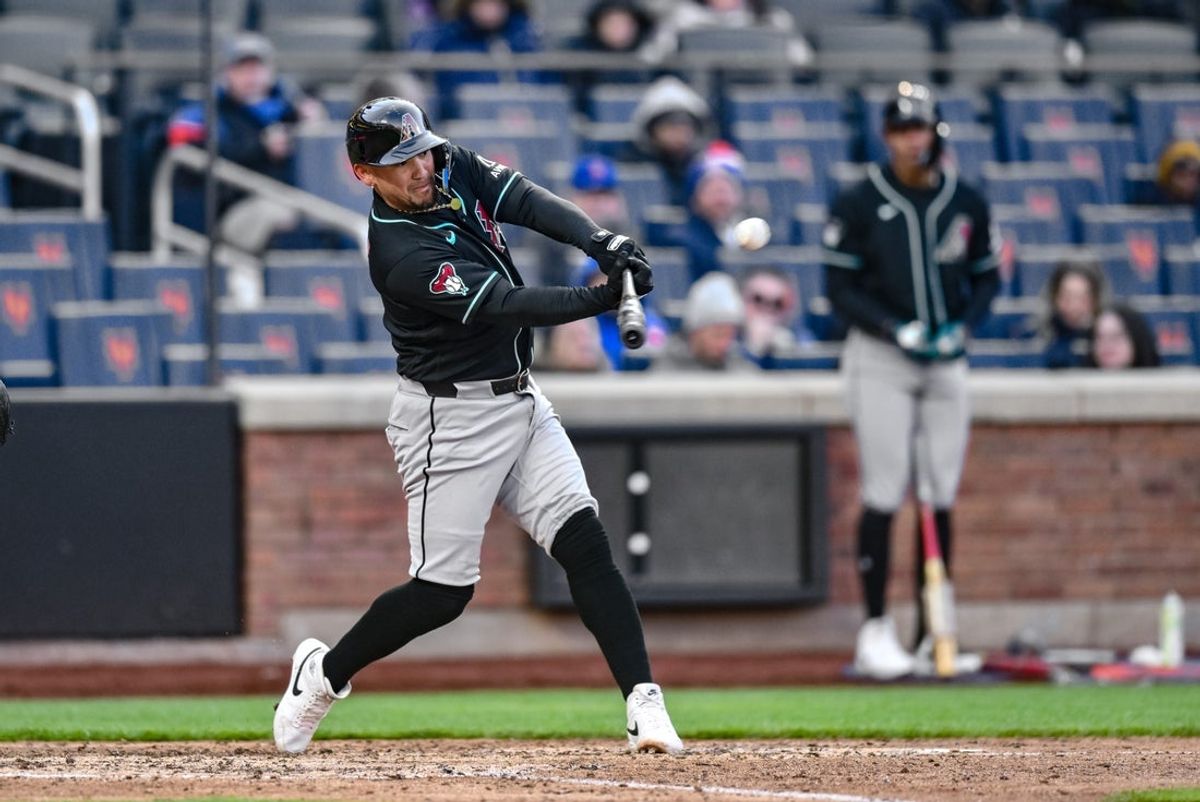 Apr 8, 2026; New York City, New York, USA; Arizona Diamondbacks second baseman Ildemaro Vargas (6) hits a single against the New York Mets during the eighth inning at Citi Field. Mandatory Credit: John Jones-Imagn Images