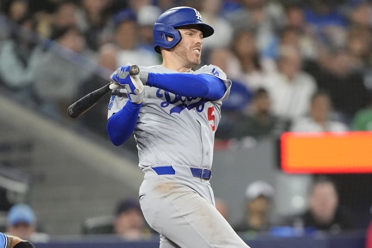 Apr 8, 2026; Toronto, Ontario, CAN; Los Angeles Dodgers first baseman Freddie Freeman (5) hits a single against the Toronto Blue Jays during the sixth inning at Rogers Centre. Mandatory Credit: John E. Sokolowski-Imagn Images