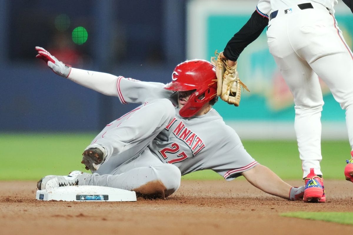 Apr 8, 2026; Miami, Florida, USA; Cincinnati Reds first baseman Sal Stewart (27) steals second base in the first inning as Miami Marlins second baseman Xavier Edwards (9) is late with the tag at loanDepot Park. Mandatory Credit: Jim Rassol-Imagn Images