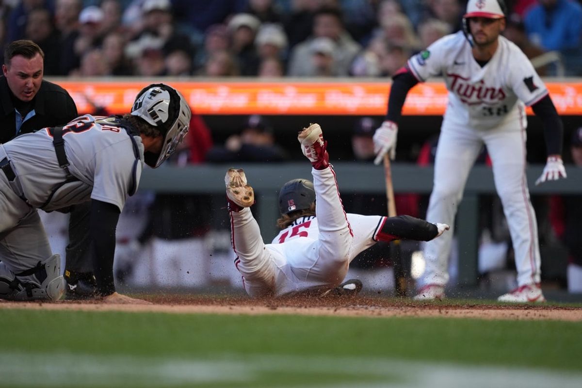 Apr 8, 2026; Minneapolis, Minnesota, USA; Minnesota Twins second baseman Luke Keaschall (15) scores during the first inning against the Detroit Tigers at Target Field. Mandatory Credit: Jordan Johnson-Imagn Images