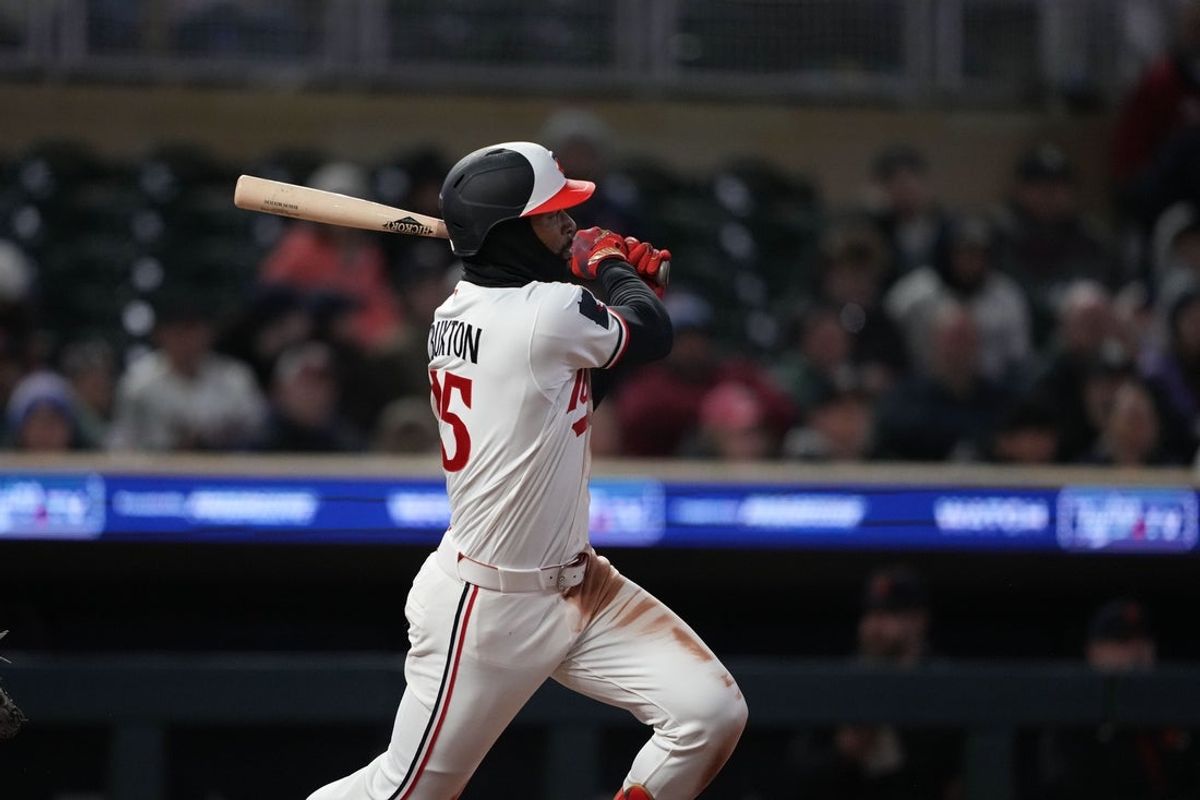 Apr 8, 2026; Minneapolis, Minnesota, USA; Minnesota Twins center fielder Byron Buxton (25) hits a double during the sixth inning against the Detroit Tigers at Target Field. Mandatory Credit: Jordan Johnson-Imagn Images