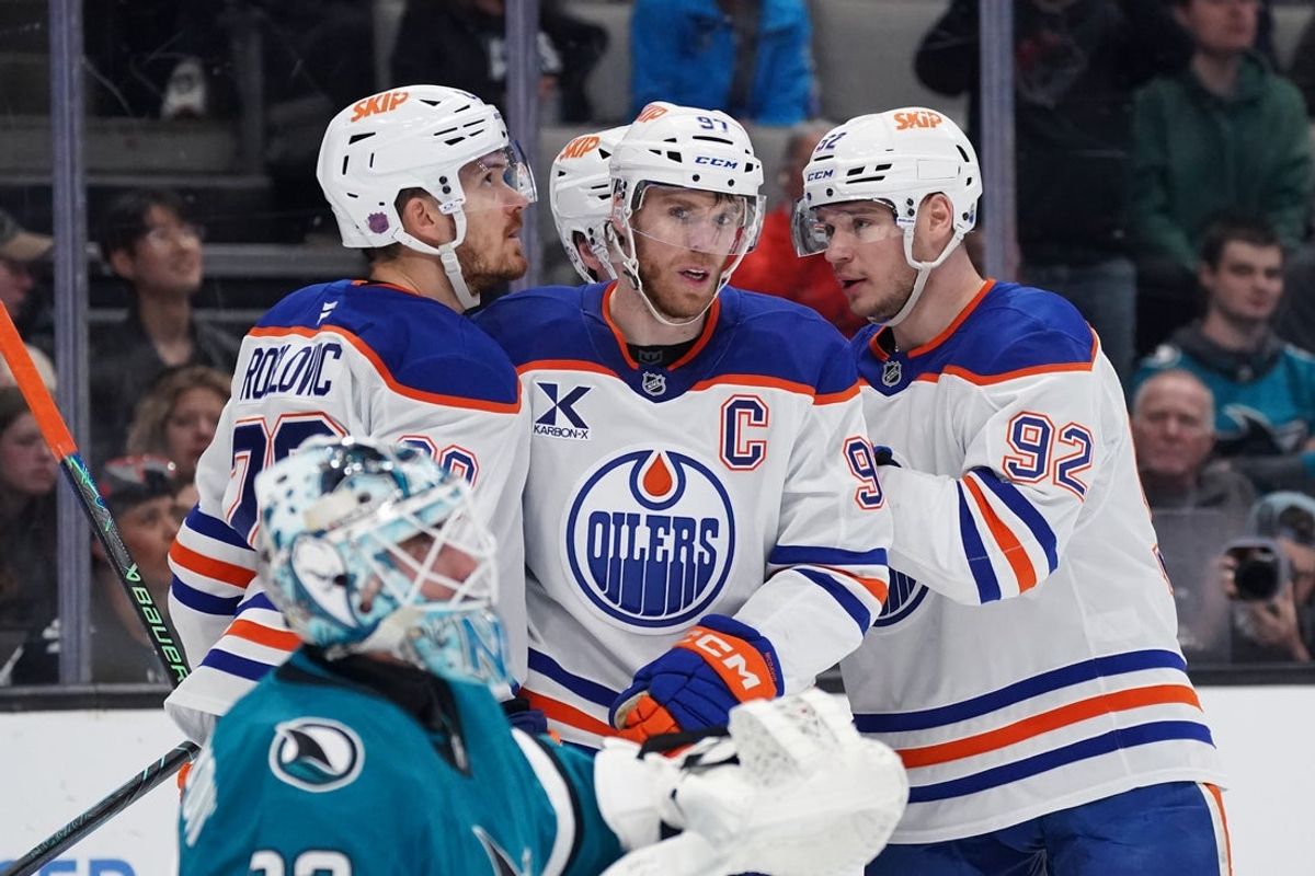 Apr 8, 2026; San Jose, California, USA;  Edmonton Oilers center Connor McDavid (97) is congratulated by teammates after scoring against the San Jose Sharks during the first period at SAP Center at San Jose. Mandatory Credit: David Gonzales-Imagn Images