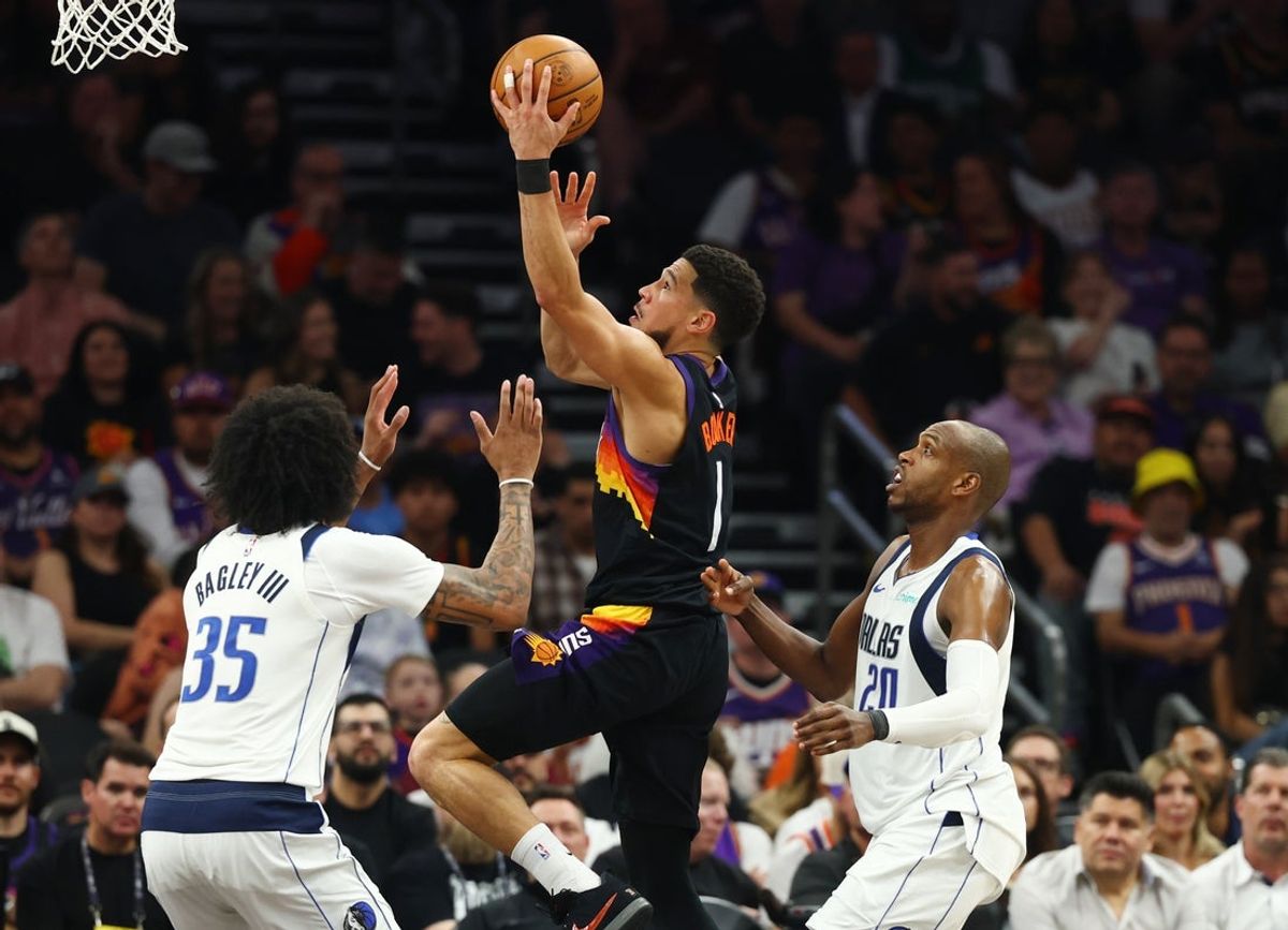 Apr 8, 2026; Phoenix, Arizona, USA; Phoenix Suns guard Devin Booker (1) drives to the basket against the Dallas Mavericks in the first half at Mortgage Matchup Center. Mandatory Credit: Mark J. Rebilas-Imagn Images