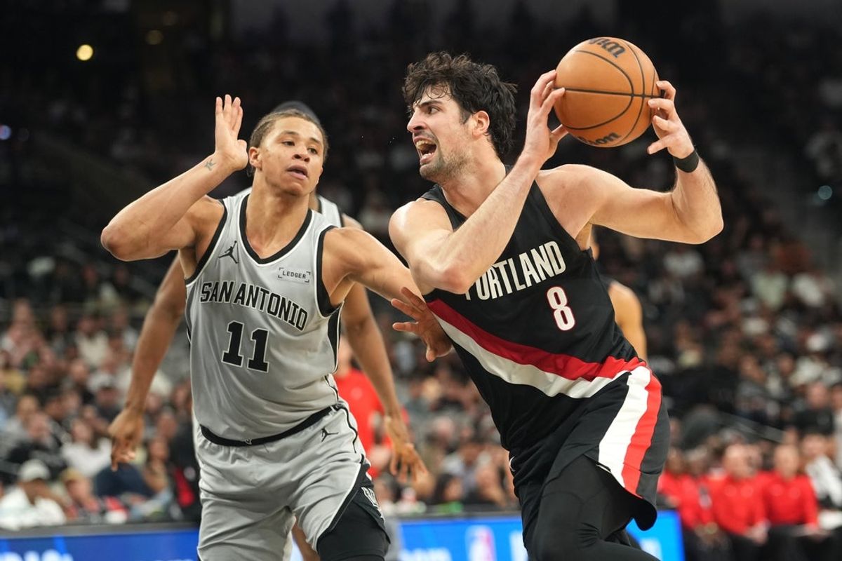 Apr 8, 2026; San Antonio, Texas, USA; Portland Trail Blazers forward Deni Avdija (8) drives to the basket against San Antonio Spurs forward Carter Bryant (11) during the second half at Frost Bank Center. Mandatory Credit: Scott Wachter-Imagn Images