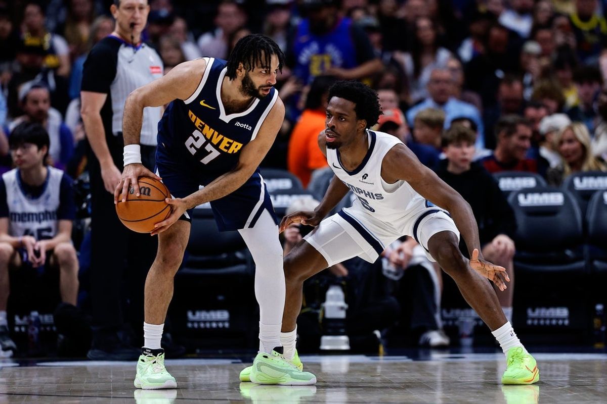 Apr 8, 2026; Denver, Colorado, USA; Denver Nuggets guard Jamal Murray (27) controls the ball as Memphis Grizzlies forward Toby Okani (5) guards in the third quarter at Ball Arena. Mandatory Credit: Isaiah J. Downing-Imagn Images