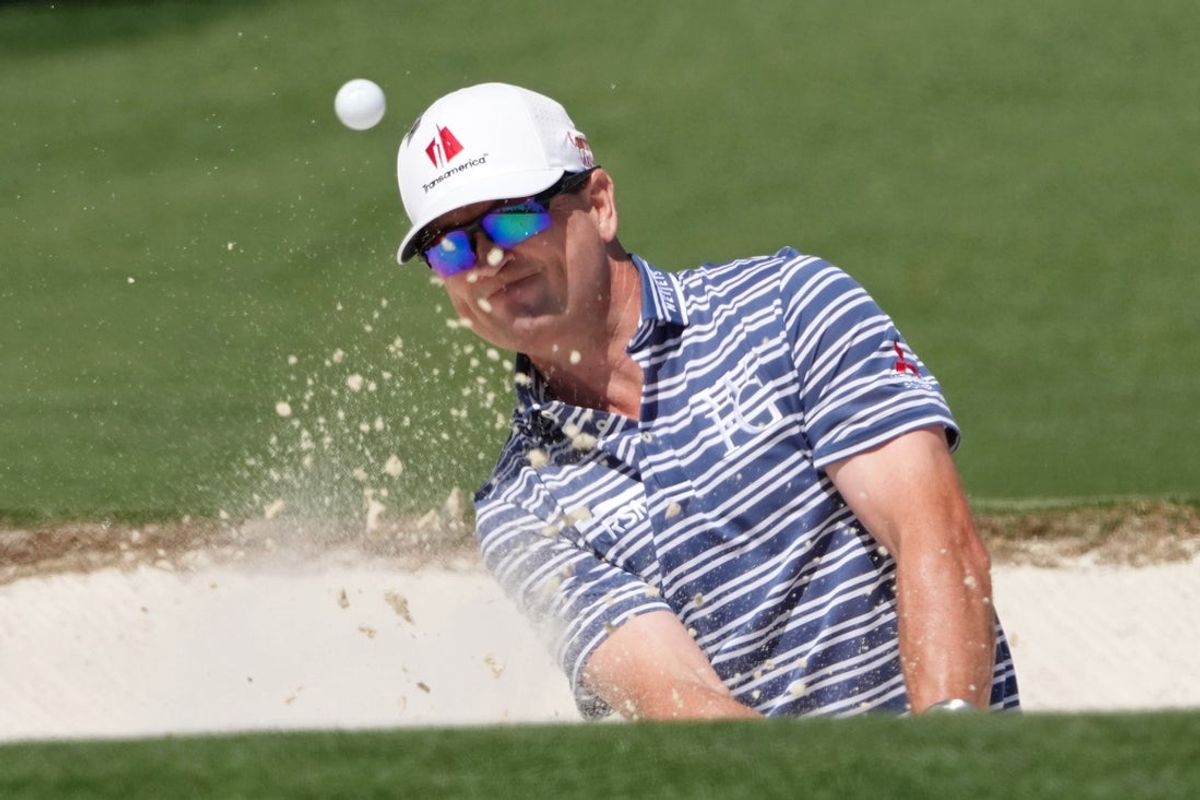 Apr 9, 2026; Augusta, Georgia, USA; Zach Johnson plays a shot from a bunker on the second hole during the first round of the Masters Tournament at Augusta National Golf Club. Mandatory Credit: Michael Madrid-Imagn Images