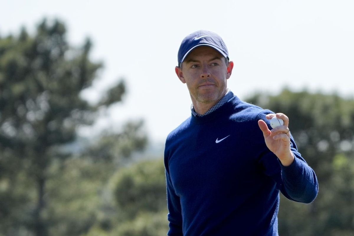 Apr 9, 2026; Augusta, Georgia, USA; Rory McIlroy acknowledges the crowd on the 18th green during the first round of the Masters Tournament at Augusta National Golf Club. Mandatory Credit: Kyle Terada-Imagn Images