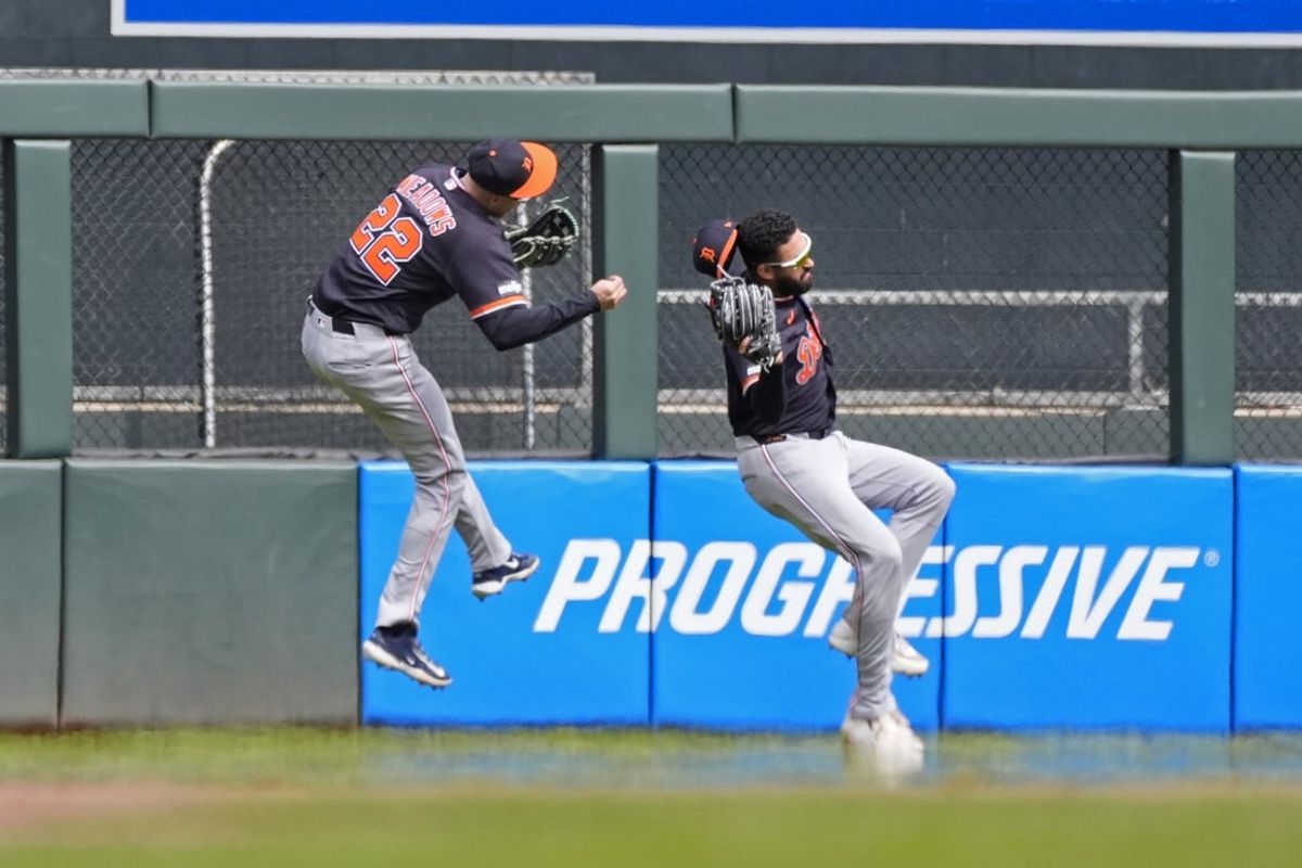Apr 9, 2026; Minneapolis, Minnesota, USA; Detroit Tigers center fielder Parker Meadows (22) collides with left fielder Riley Greene (31) on a fly ball hit by Minnesota Twins designated hitter Josh Bell (not pictured) in the eighth inning at Target Field. Meadows left the game. Mandatory Credit: Bruce Kluckhohn-Imagn Images