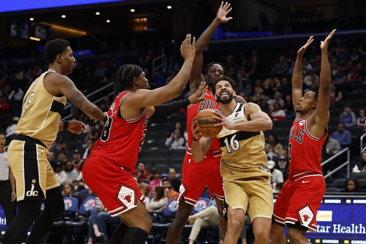 Apr 9, 2026; Washington, District of Columbia, USA; Washington Wizards forward Anthony Gill (16) drives to the basket as Chicago Bulls forward Guerschon Yabusele (28) and Bulls guard Collin Sexton (2) defend in the first half at Capital One Arena. Mandatory Credit: Geoff Burke-Imagn Images