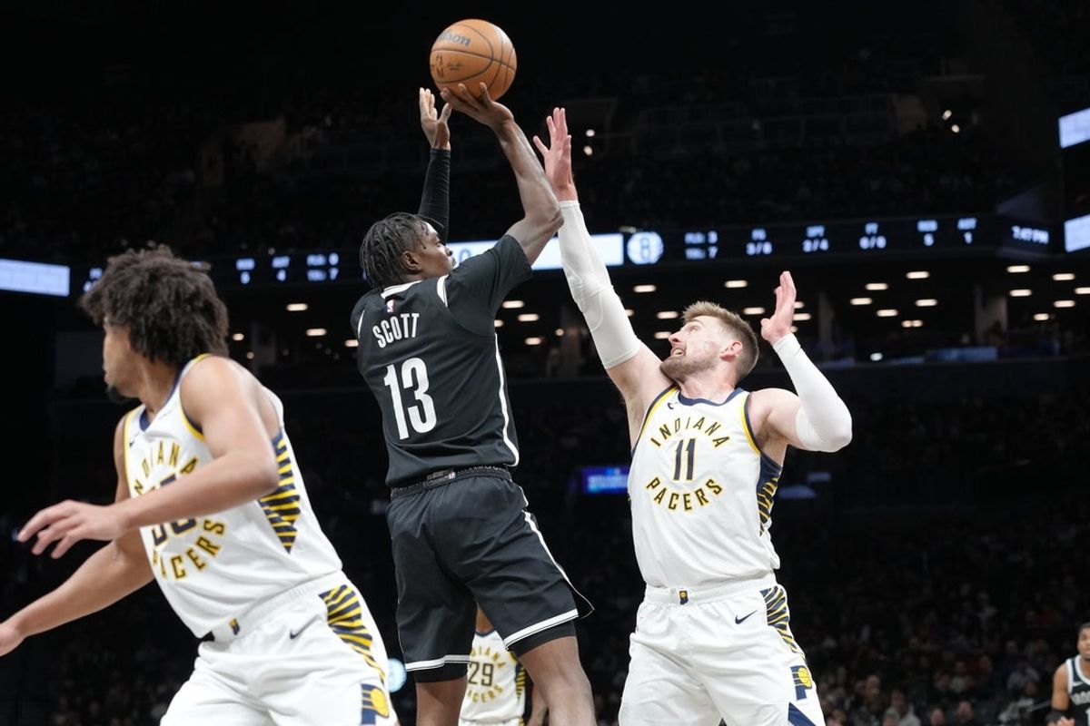 Apr 9, 2026; Brooklyn, New York, USA; Brooklyn Nets forward Trevon Scott (13) shoots the ball against Indiana Pacers center Micah Potter (11) during the first half at Barclays Center. Mandatory Credit: Gregory Fisher-Imagn Images
