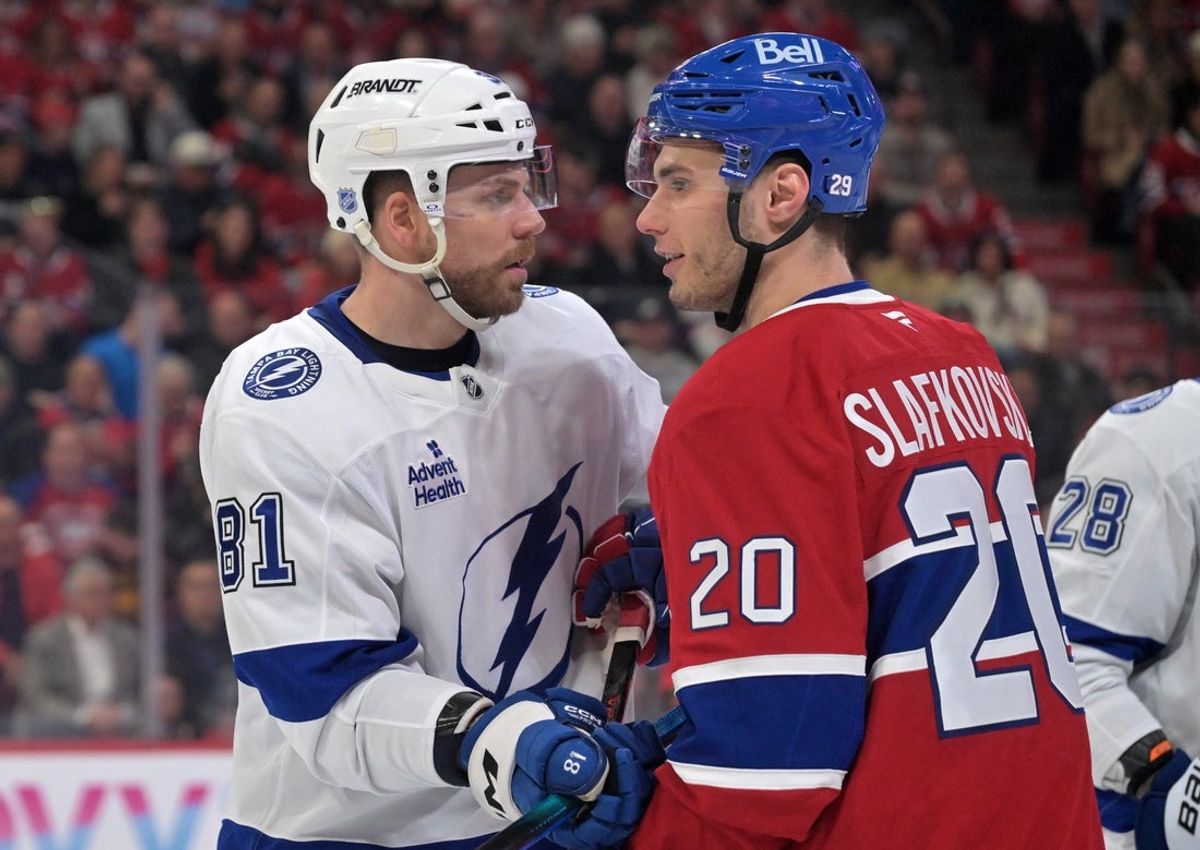 Apr 9, 2026; Montreal, Quebec, CAN; Tampa Bay Lightning defenseman Erik Cernak (81) vies for position with Montreal Canadiens forward Juraj Slafkovsky (20) during the second period at the Bell Centre. Mandatory Credit: Eric Bolte-Imagn Images