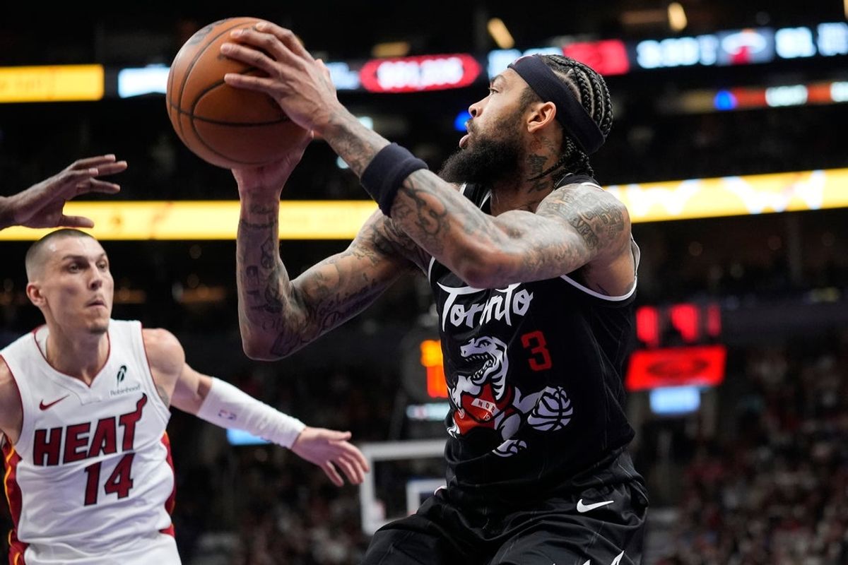 Apr 9, 2026; Toronto, Ontario, CAN; Toronto Raptors forward Brandon Ingram (3) controls the ball against Miami Heat guard Tyler Herro (14) during the second half at Scotiabank Arena. Mandatory Credit: John E. Sokolowski-Imagn Images
