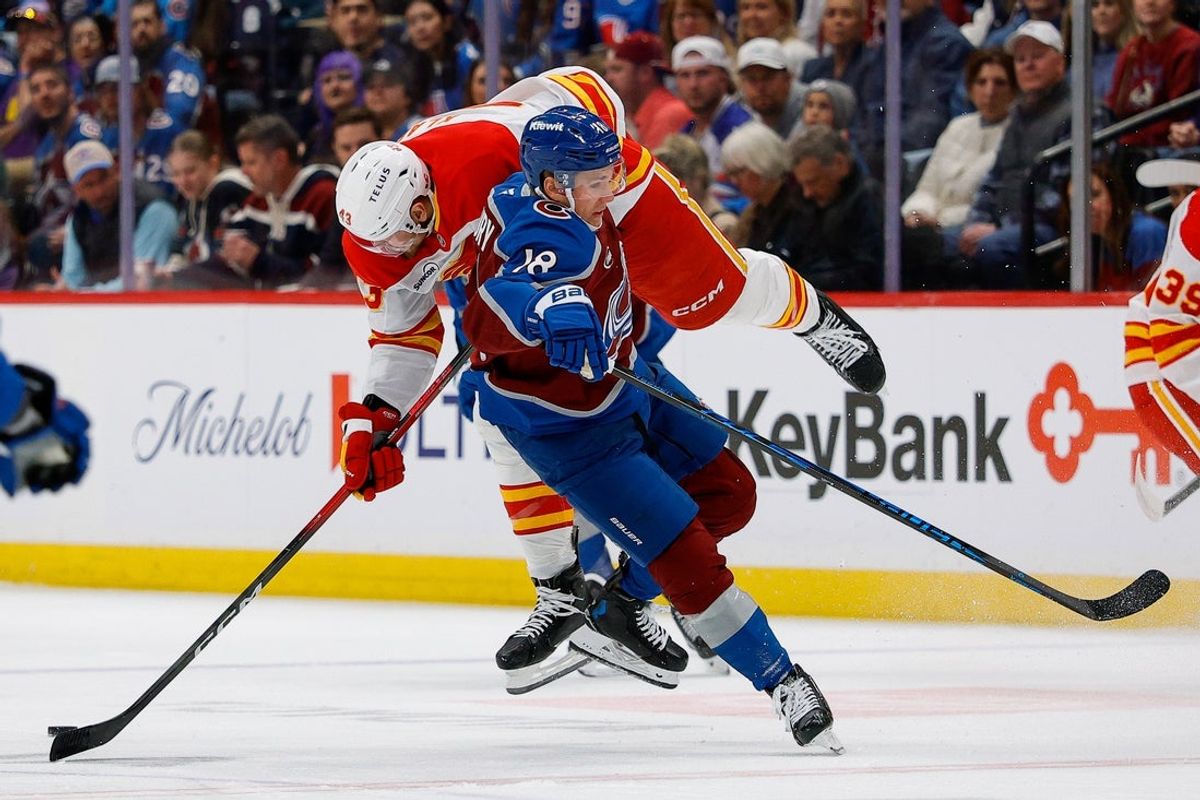 Apr 9, 2026; Denver, Colorado, USA; Colorado Avalanche center Jack Drury (18) and Calgary Flames right wing Adam Klapka (43) collide in the first period at Ball Arena. Mandatory Credit: Isaiah J. Downing-Imagn Images