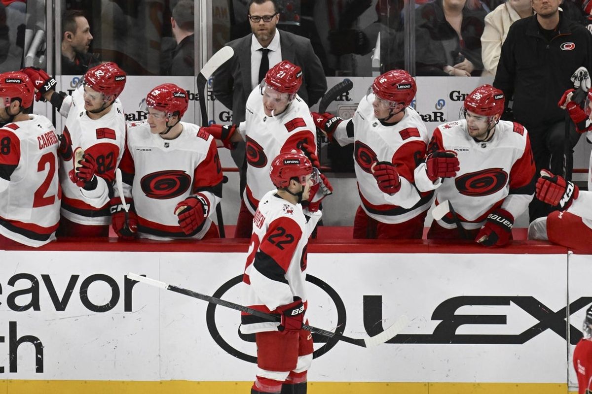 Apr 9, 2026; Chicago, Illinois, USA;  Carolina Hurricanes center Logan Stankoven (22) celebrates with teammates after he scores a goal against the Chicago Blackhawks during the second period at the United Center. Mandatory Credit: Matt Marton-Imagn Images