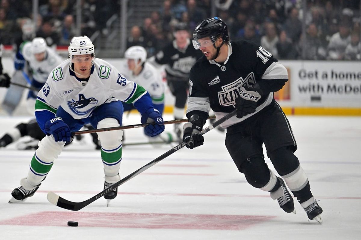 Apr 9, 2026; Los Angeles, California, USA;  Vancouver Canucks center Teddy Blueger (53) chases down Los Angeles Kings left wing Artemi Panarin (10) during the second period at Crypto.com Arena. Mandatory Credit: Jayne Kamin-Oncea-Imagn Images