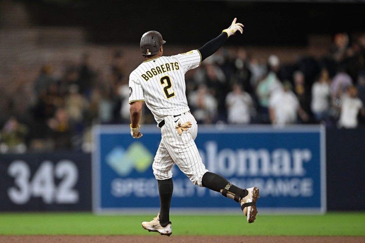 Apr 9, 2026; San Diego, California, USA; San Diego Padres shortstop Xander Bogaerts (2) runs the bases after hitting a walk-off grand slam home run against Colorado Rockies relief pitcher Valente Bellozo (not pictured) in the twelfth inning at Petco Park. Mandatory Credit: Denis Poroy-Imagn Images