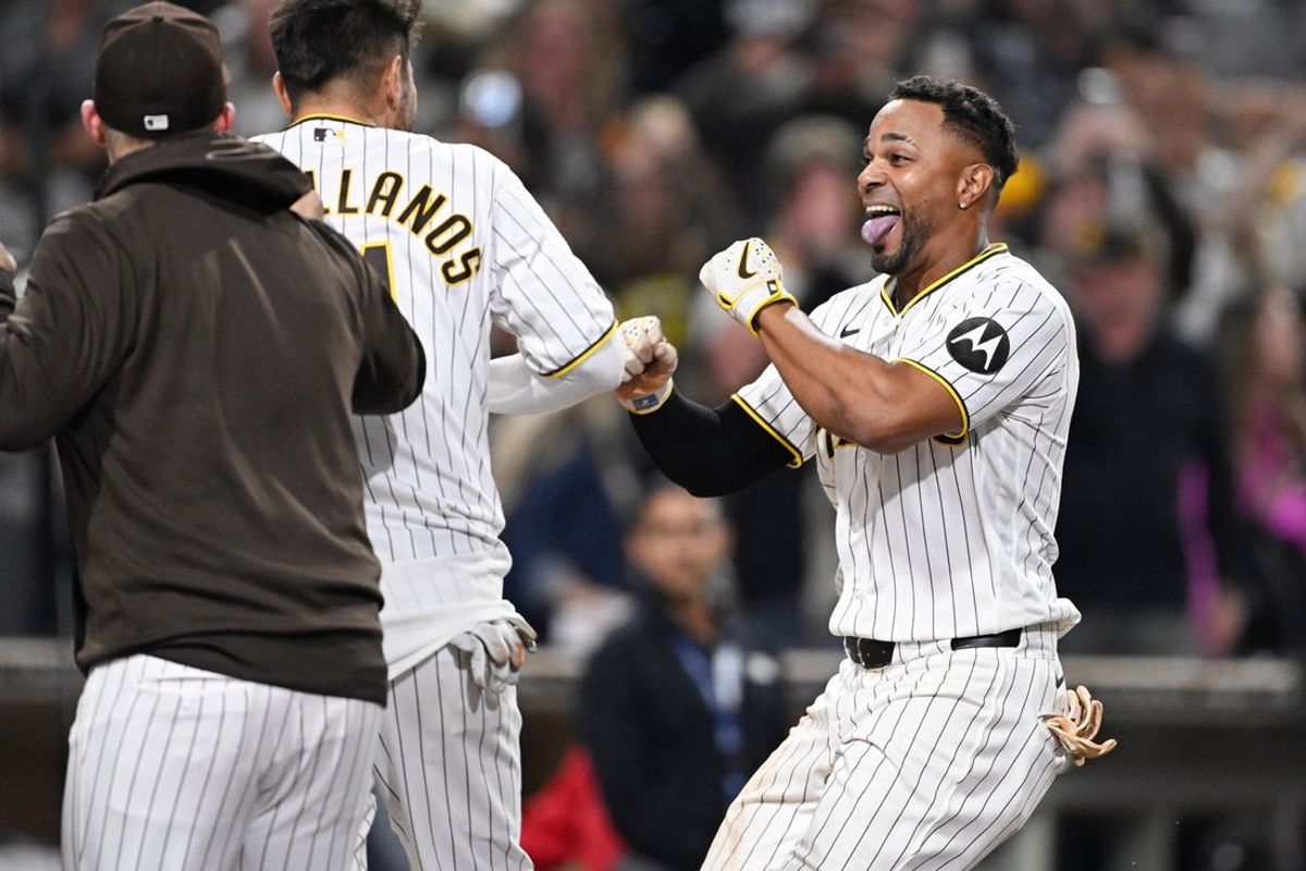 Apr 9, 2026; San Diego, California, USA; San Diego Padres shortstop Xander Bogaerts (2) celebrates with teammates after hitting a walk-off grand slam home run against Colorado Rockies relief pitcher Valente Bellozo (not pictured) in the twelfth inning at Petco Park. Mandatory Credit: Denis Poroy-Imagn Images