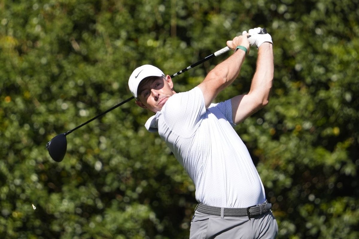 Apr 10, 2026; Augusta, Georgia, USA; Rory McIlroy tees off on the 11th hole during the second round of the Masters Tournament at Augusta National Golf Club. Mandatory Credit: Katie Goodale-Imagn Images