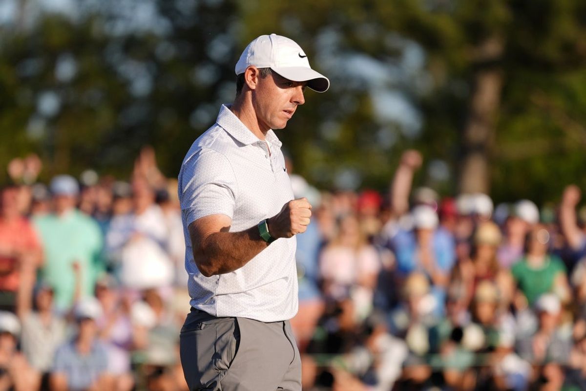 Apr 10, 2026; Augusta, Georgia, USA; Rory McIlroy reacts after a putt on the 18th green during the second round of the Masters Tournament at Augusta National Golf Club. Mandatory Credit: Katie Goodale-Imagn Images