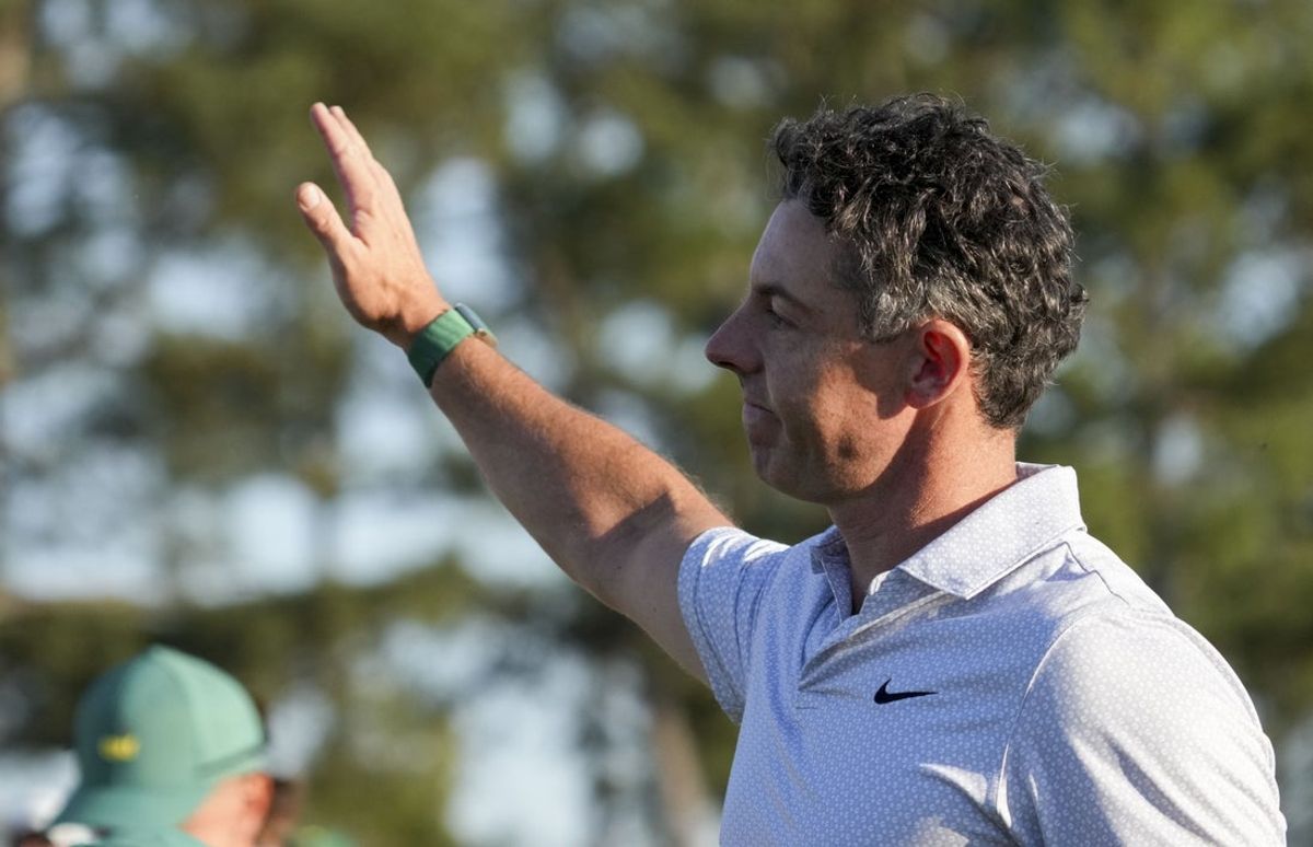 Apr 10, 2026; Augusta, Georgia, USA; Rory McIlroy waves to patrons after walking off the 18th green during the second round of the Masters Tournament at Augusta National Golf Club. Mandatory Credit: Grace Smith-Imagn Images