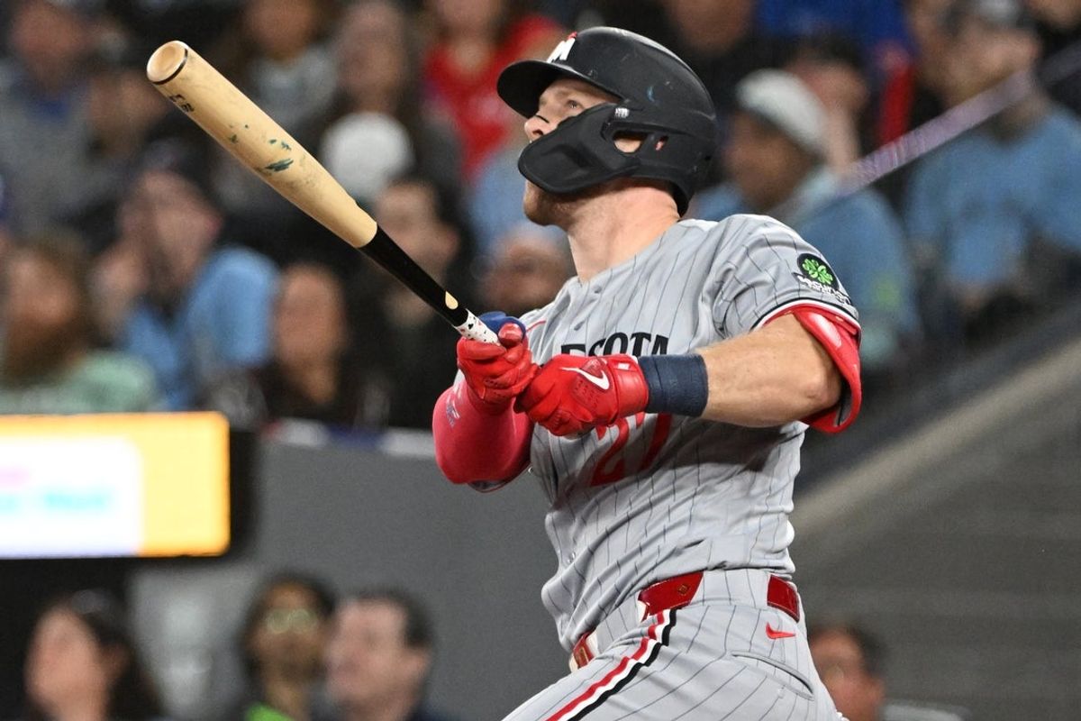 Apr 10, 2026; Toronto, Ontario, CAN;  Minnesota Twins catcher Ryan Jeffers (27) hits a three-run home run against the Toronto Blue Jays in the first inning at Rogers Centre. Mandatory Credit: Dan Hamilton-Imagn Images