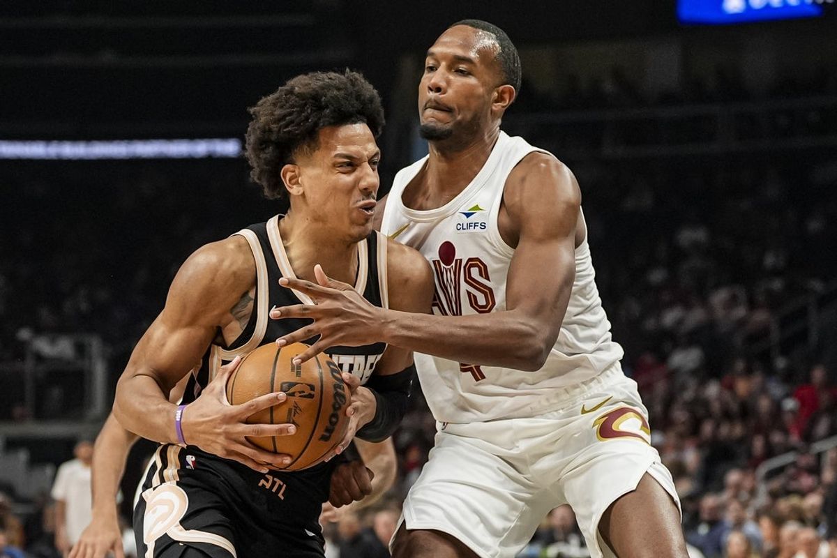 Apr 10, 2026; Atlanta, Georgia, USA; Atlanta Hawks forward Jalen Johnson (1) is defended by Cleveland Cavaliers center Evan Mobley (4) during the first half at State Farm Arena. Mandatory Credit: Dale Zanine-Imagn Images