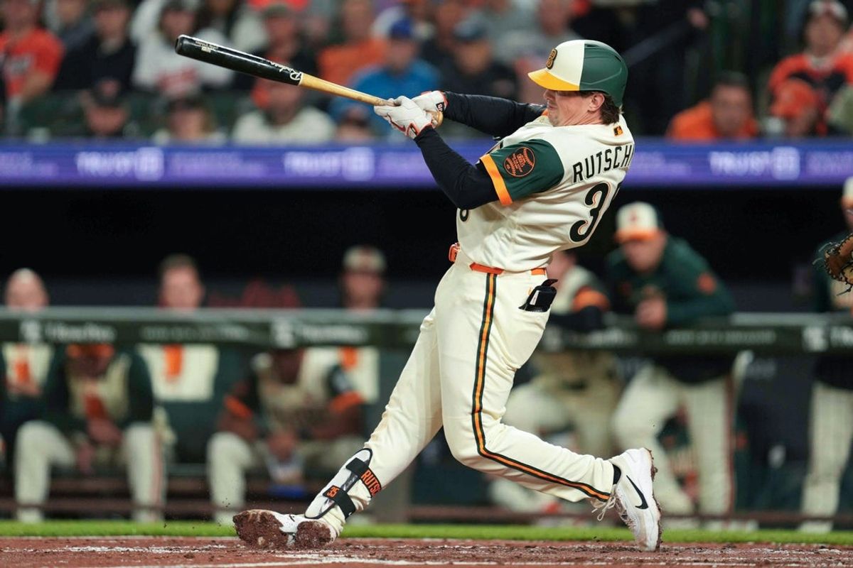Apr 10, 2026; Baltimore, Maryland, USA;  Baltimore Orioles catcher Adley Rutschman (35) doubles during the third inning against the San Francisco Giants at Oriole Park at Camden Yards. Mandatory Credit: Mitch Stringer-Imagn Images