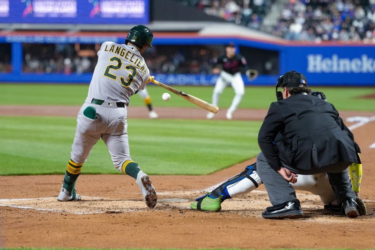 Apr 10, 2026; New York City, New York, USA; Athletics catcher Shea Langeliers (23) hits an RBI single against the New York Mets during the third inning at Citi Field. Mandatory Credit: Gregory Fisher-Imagn Images