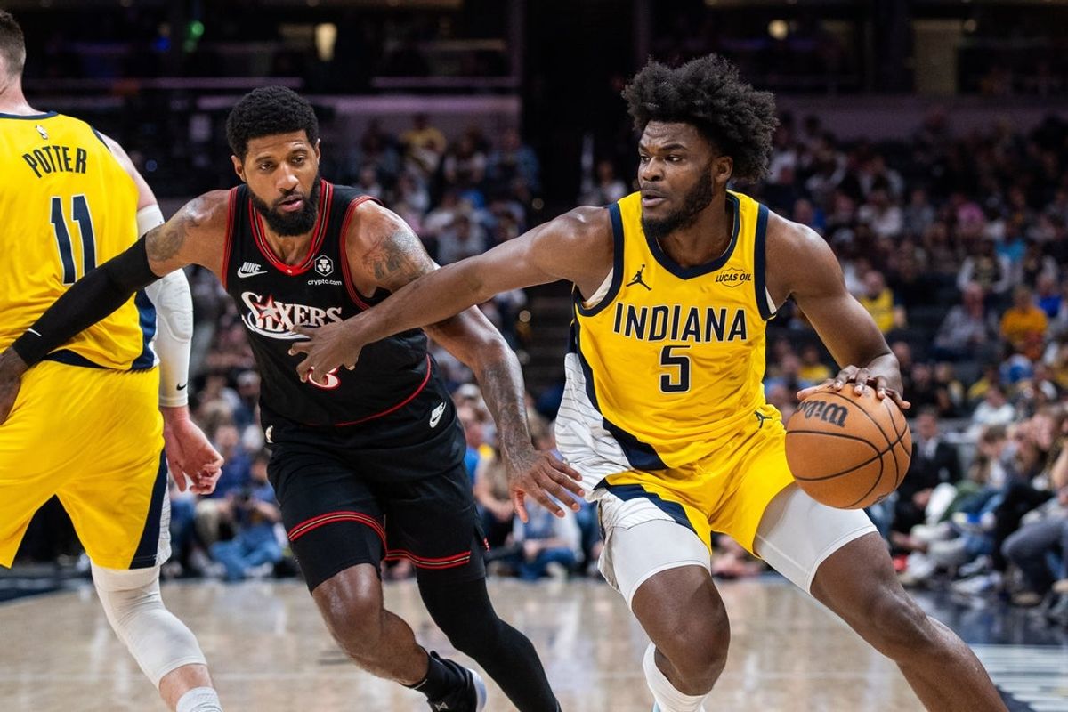 Apr 10, 2026; Indianapolis, Indiana, USA; Indiana Pacers forward Jarace Walker (5) drives to the basket against Philadelphia 76ers forward Paul George (8) during the first half at Gainbridge Fieldhouse. Mandatory Credit: Trevor Ruszkowski-Imagn Images