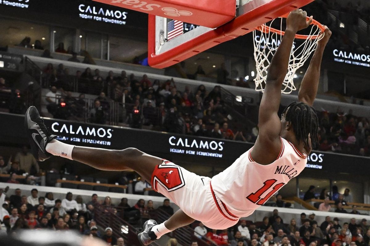 Apr 10, 2026; Chicago, Illinois, USA;  Chicago Bulls forward Leonard Miller (11) dunks the ball against the Orlando Magic during the first half at the United Center. Mandatory Credit: Matt Marton-Imagn Images