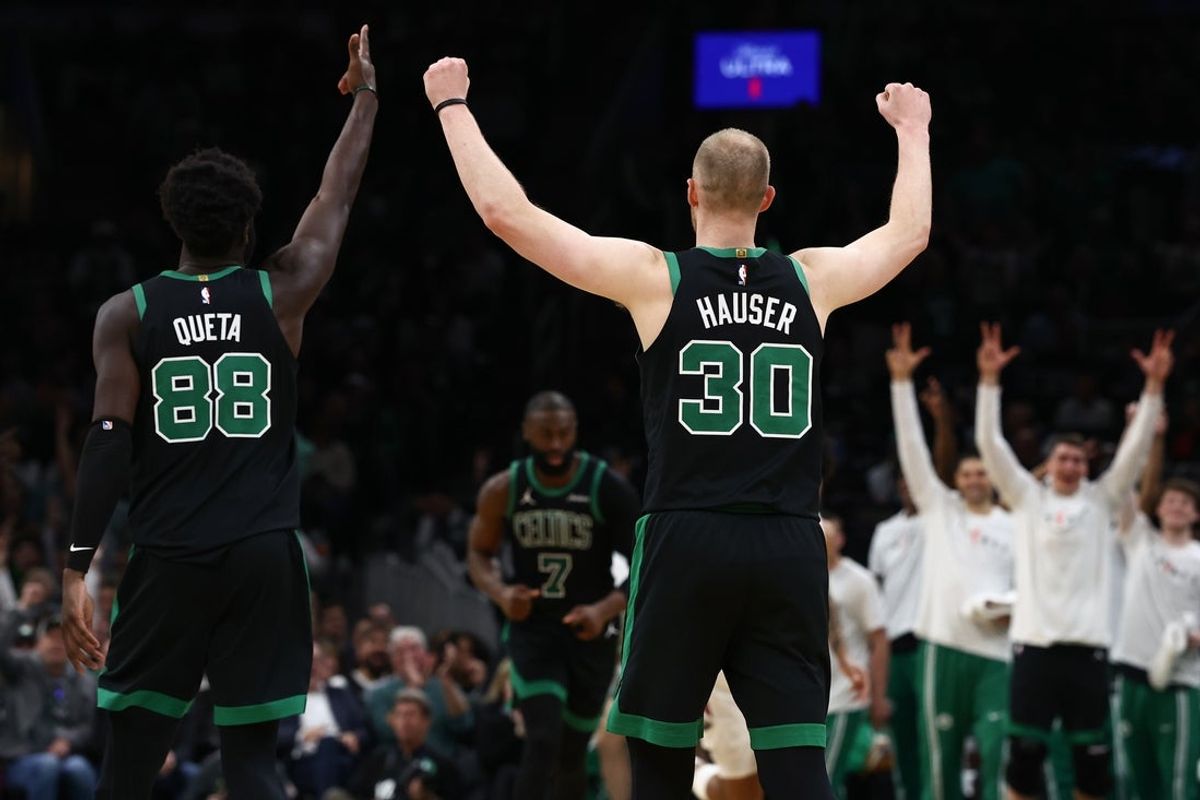 Apr 10, 2026; Boston, Massachusetts, USA; Boston Celtics forward Sam Hauser (30) and center Neemias Queta (88) celebrate during the second half against the New Orleans Pelicans at TD Garden. Mandatory Credit: Winslow Townson-Imagn Images