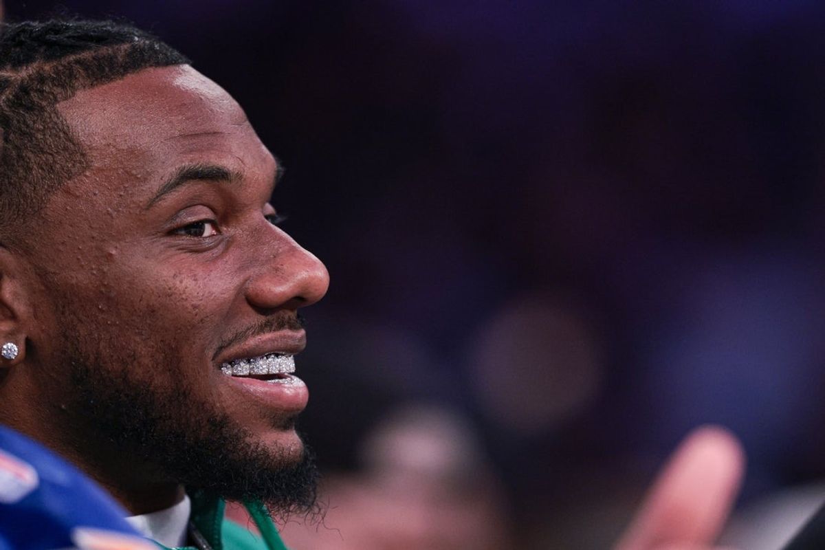 Apr 10, 2026; New York, New York, USA; New York Giants wide receiver Malik Nabers sits court-side during the second half of the NBA game between the New York Knicks and the Toronto Raptors at Madison Square Garden. Mandatory Credit: Vincent Carchietta-Imagn Images