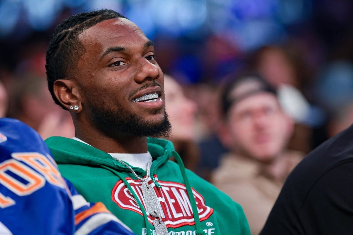 Apr 10, 2026; New York, New York, USA; New York Giants wide receiver Malik Nabers sits court-side during the second half of the NBA game between the New York Knicks and the Toronto Raptors at Madison Square Garden. Mandatory Credit: Vincent Carchietta-Imagn Images