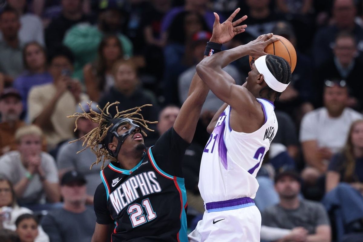 Apr 10, 2026; Salt Lake City, Utah, USA; Memphis Grizzlies guard Jahmai Mashack (21) defends a shot by Utah Jazz guard Bez Mbeng (21) during the first half at Delta Center. Mandatory Credit: Rob Gray-Imagn Images