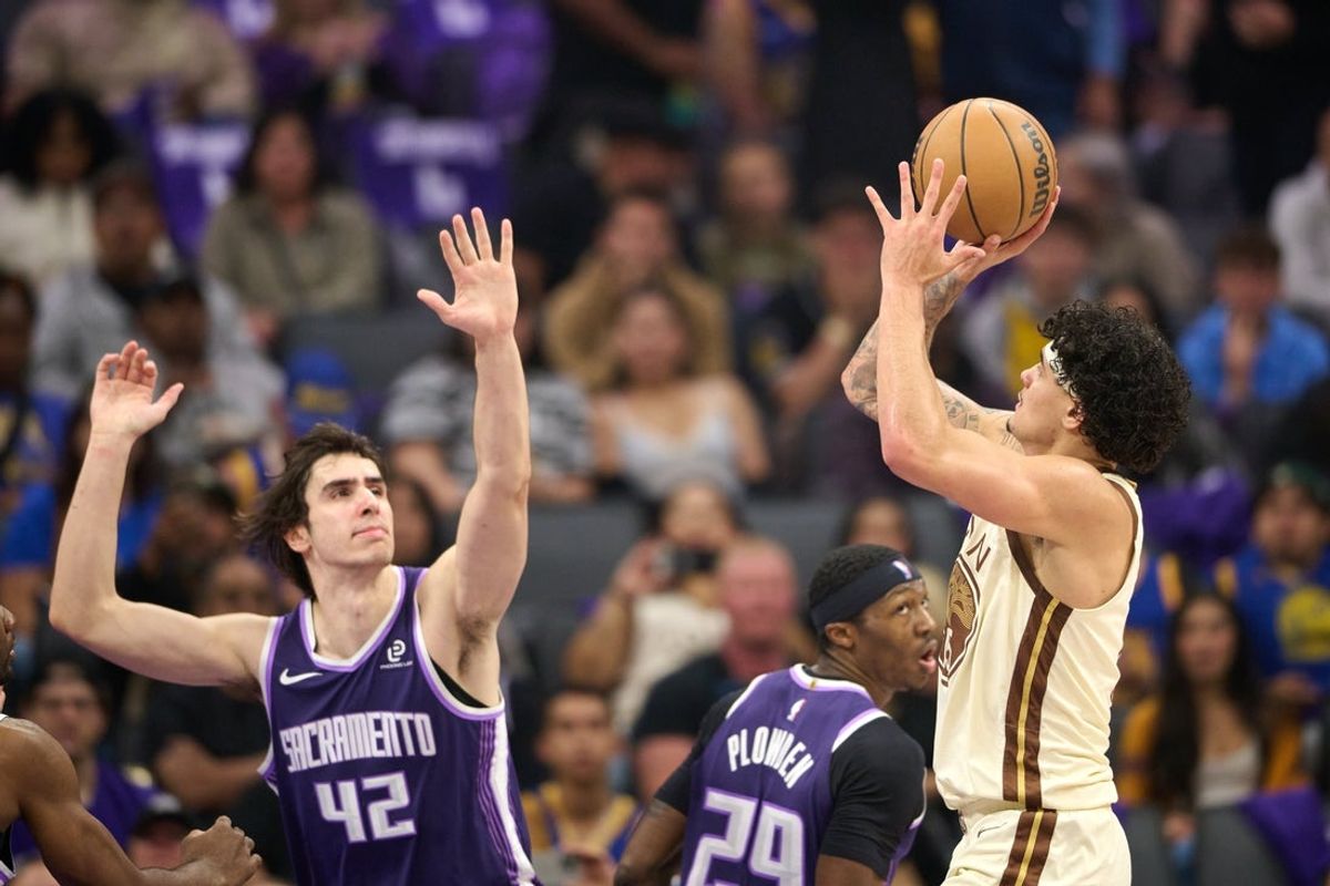 Apr 10, 2026; Sacramento, California, USA; Golden State Warriors forward Gui Santos (15) shoots the ball against Sacramento Kings center Maxime Raynaud (42) and guard Daeqwon Plowden (29) during the first quarter at Golden 1 Center. Mandatory Credit: Robert Edwards-Imagn Images