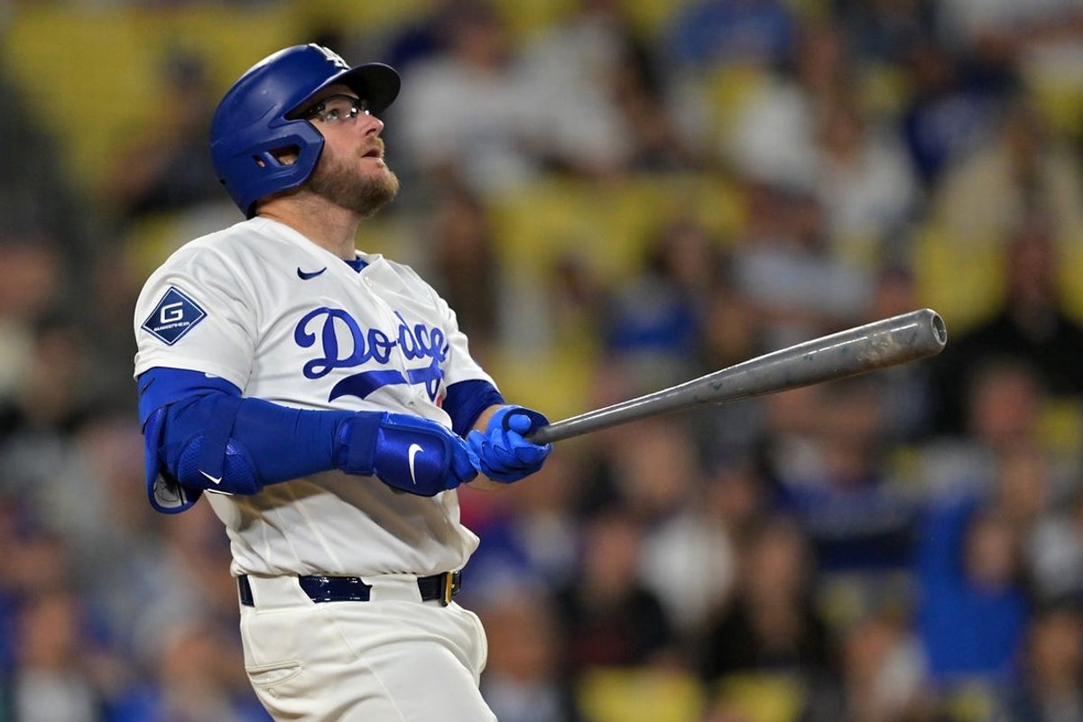 Apr 10, 2026; Los Angeles, California, USA; Los Angeles Dodgers third baseman Max Muncy (13) watches the flight of the ball on a walk-off solo home run in the ninth inning to defeat the Texas Rangers at Dodger Stadium. Mandatory Credit: Jayne Kamin-Oncea-Imagn Images