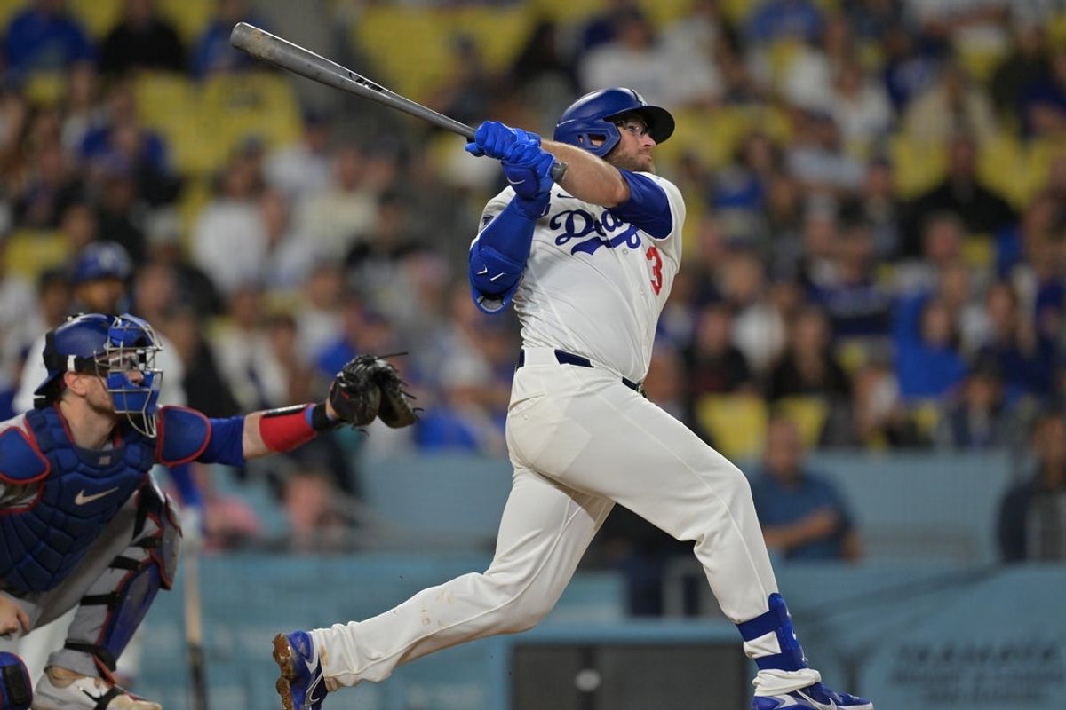Apr 10, 2026; Los Angeles, California, USA; Los Angeles Dodgers third baseman Max Muncy (13) hits a walk-off solo home run in the ninth inning to defeat the Texas Rangers at Dodger Stadium. Mandatory Credit: Jayne Kamin-Oncea-Imagn Images
