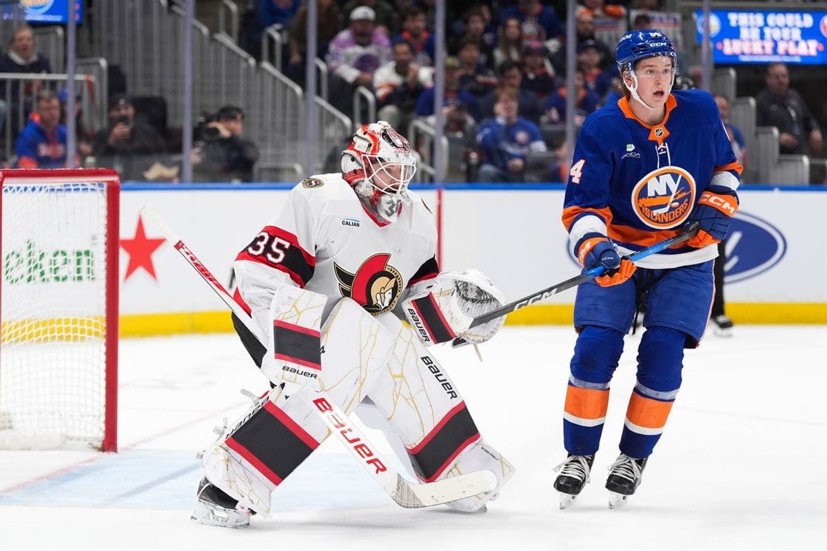 Apr 11, 2026; Elmont, New York, USA; New York Islanders center Calum Ritchie (64) stands in front of Ottawa Senators goaltender Linus Ullmark (35) in the second period at UBS Arena. Mandatory Credit: Alexander Wohl-Imagn Images