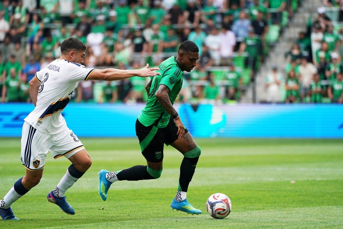 Apr 11, 2026; Austin, Texas, USA; Austin FC midfielder Joseph Rosales (30) controls the ball against LA Galaxy midfielder Lucas Sanabria (8) during the first half at Q2 Stadium. Mandatory Credit: Dustin Safranek-Imagn Images
