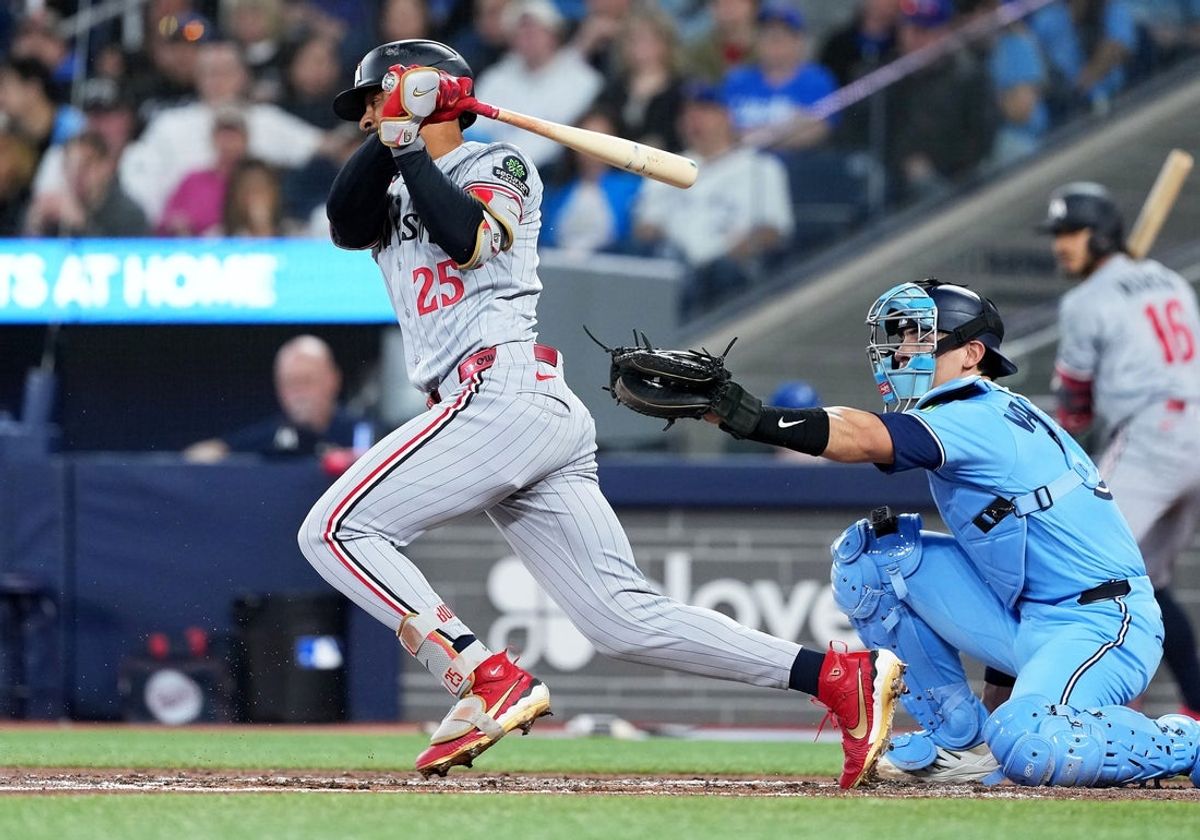 Apr 11, 2026; Toronto, Ontario, CAN; Minnesota Twins center fielder Byron Buxton (25) hits a single against the Toronto Blue Jays during the third inning at Rogers Centre. Mandatory Credit: Nick Turchiaro-Imagn Images
