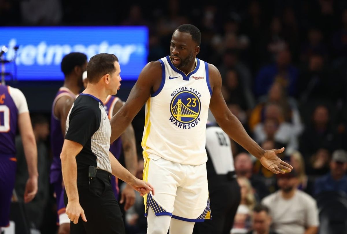 Dec 12, 2023; Phoenix, Arizona, USA; Golden State Warriors forward Draymond Green (23) reacts as he argues with an NBA referee against the Phoenix Suns at Footprint Center.