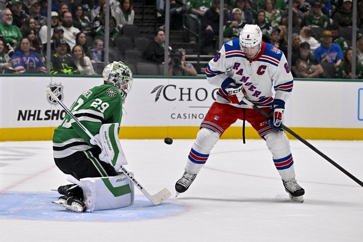 Apr 11, 2026; Dallas, Texas, USA; Dallas Stars goaltender Jake Oettinger (29) stops a shot by New York Rangers left wing J.T. Miller (8) during the first period at the American Airlines Center. Mandatory Credit: Jerome Miron-Imagn Images