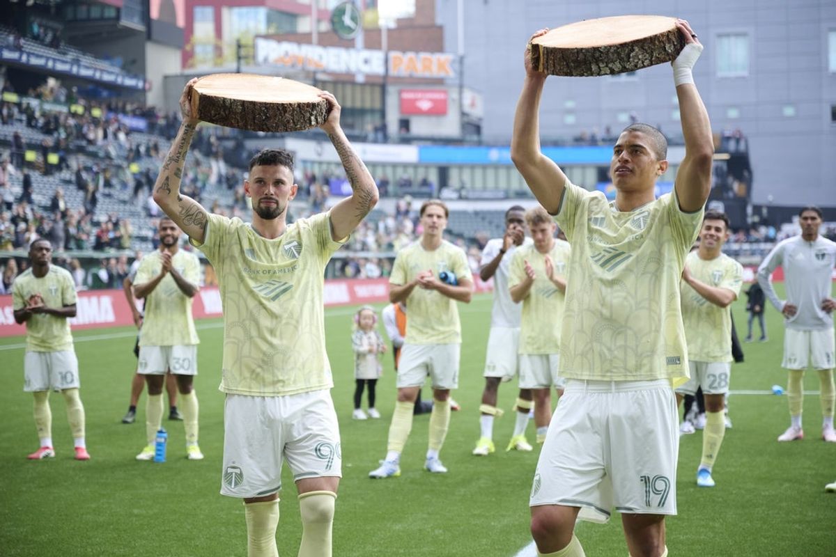 Apr 11, 2026; Portland, Oregon, USA; Portland Timbers forward Kristoffer Velde (99), left, and  forward Kevin Kelsy (19) celebrate after a game against Los Angeles FC at Providence Park. Mandatory Credit: Troy Wayrynen-Imagn Images