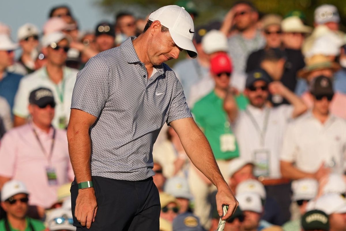 Apr 11, 2026; Augusta, Georgia, USA; Rory McIlroy reacts after a putt on the 18th green during the third round of the Masters Tournament at Augusta National Golf Club. Mandatory Credit: Michael Madrid-Imagn Images