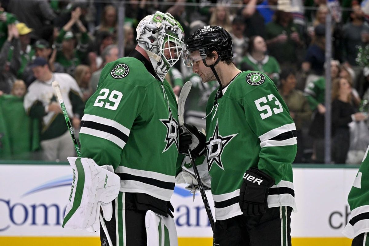 Apr 11, 2026; Dallas, Texas, USA; Dallas Stars center Wyatt Johnston (53) and goaltender Jake Oettinger (29) celebrate after the Stars defeat the New York Rangers at the American Airlines Center. Mandatory Credit: Jerome Miron-Imagn Images
