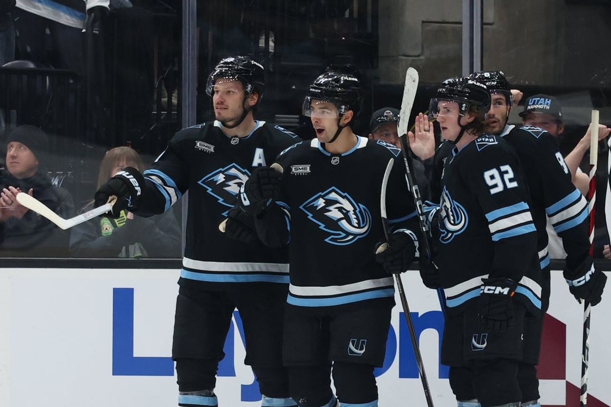 Apr 11, 2026; Salt Lake City, Utah, USA;  Utah Mammoth right wing Dylan Guenther (11) celebrates with teammates after scoring a goal against the Carolina Hurricanes during the third period at Delta Center. Mandatory Credit: Rob Gray-Imagn Images