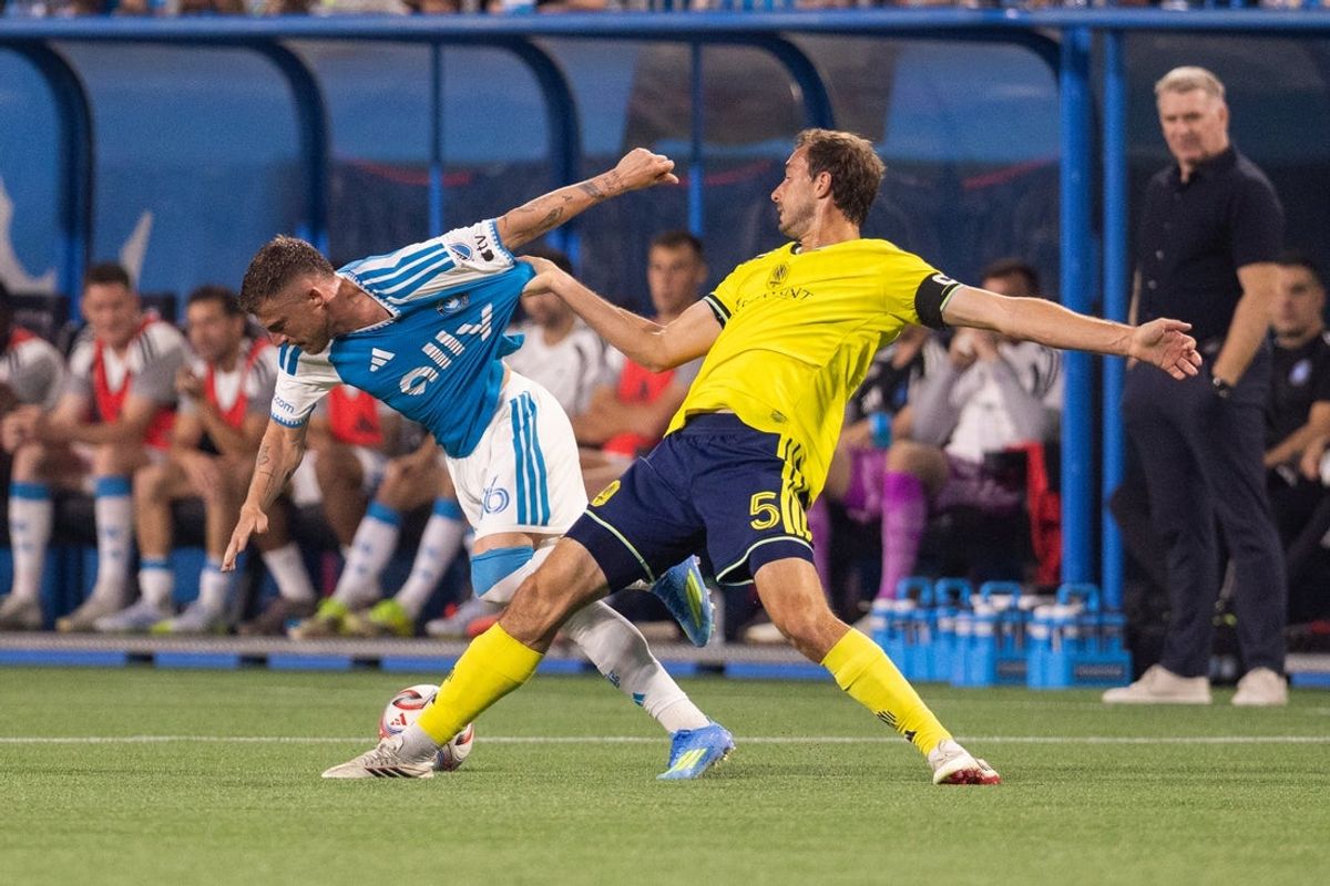 Apr 11, 2026; Charlotte, North Carolina, USA; Charlotte FC midfielder Pep Biel (16) gets tied up with Nashville SC defender Jack Maher (5) during the first half at Bank of America Stadium. Mandatory Credit: Scott Kinser-Imagn Images